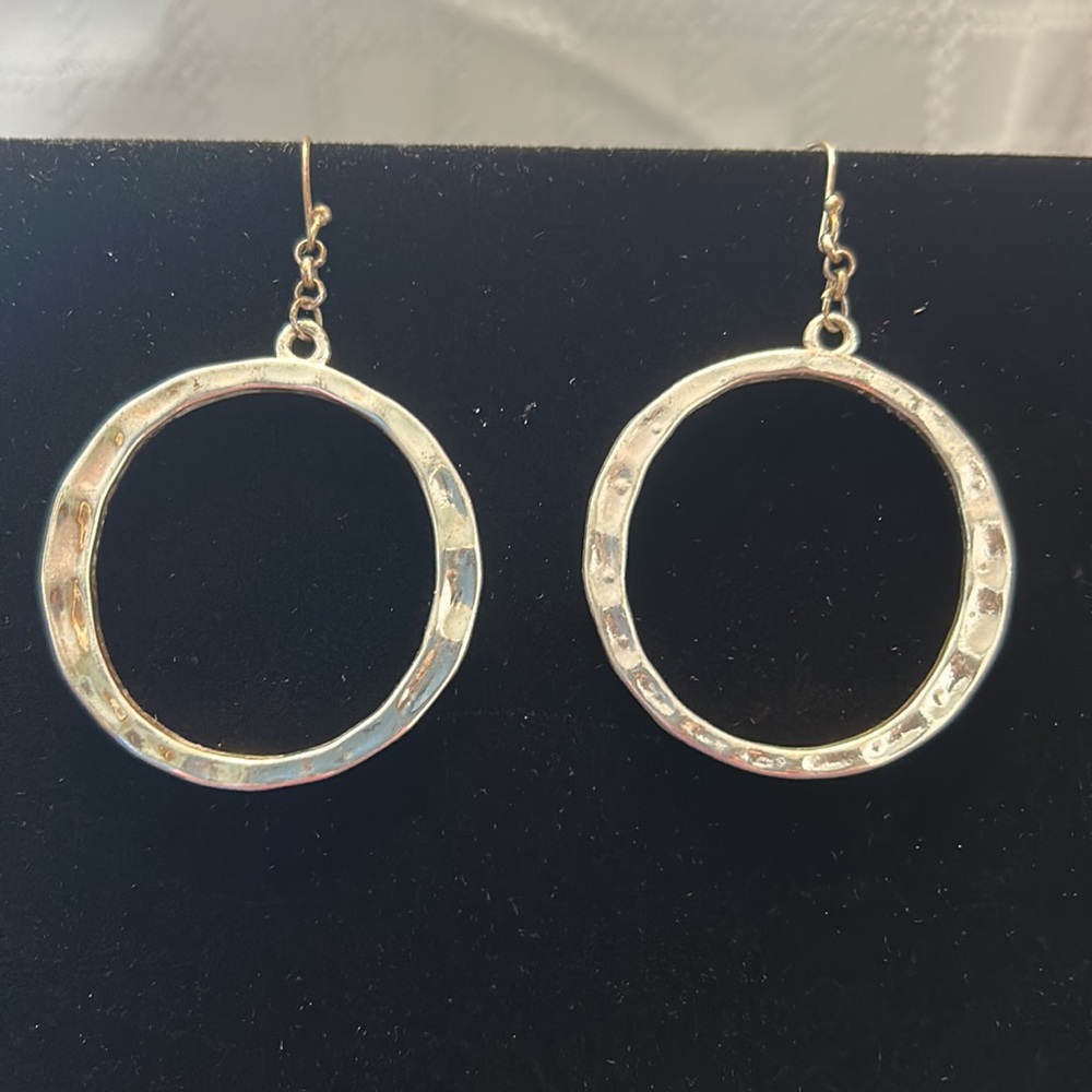 Silver hoop earrings for pierced ears.